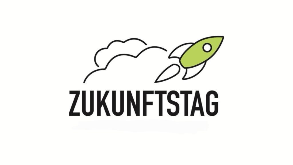 Das Bild zeigt den Schriftzug „Zukunftstag“ mit der Grafik einer grünen Rakete und einer Rauchfahne. Die Rakete ist rechts vom Text positioniert und vermittelt ein Gefühl von Fortschritt und Innovation.